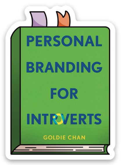 A signed and personalized green copy of Personal Branding for Introverts by Goldie Chan from Yu & Me Books includes two ribbon bookmarks, a sticker, and a keychain—ideal for introverts seeking expert branding advice.