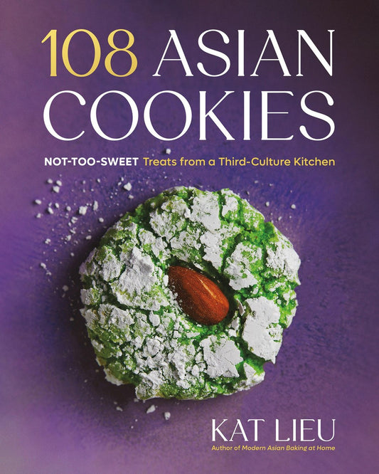 Book cover for "108 Asian Cookies by Kat Lieu (Signed & Personalized)" from Yu & Me Books, featuring a green crinkle cookie with an almond center and powdered sugar on a purple background—ideal for creative Asian cookie lovers.