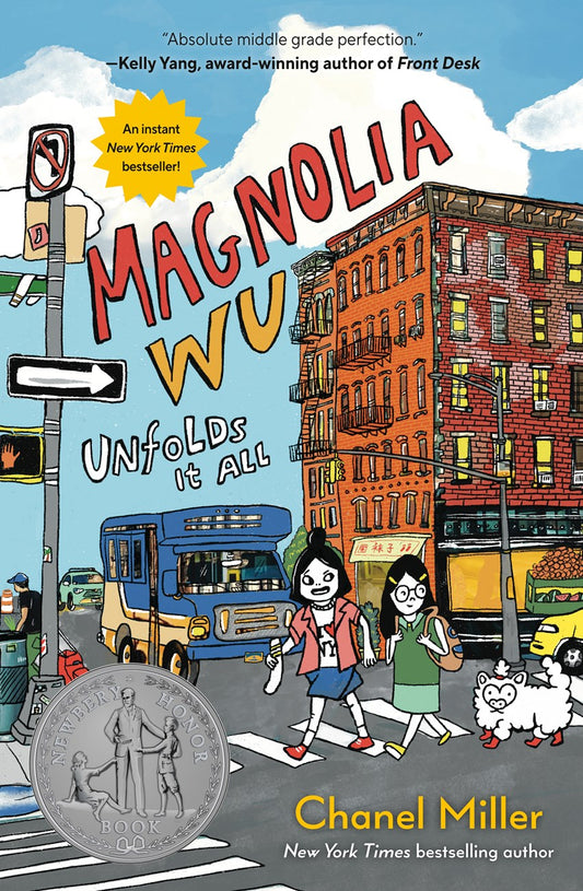 The illustrated cover of "Magnolia Wu Unfolds It All" by Chanel Miller (Signed!), available from Yu & Me Books, shows two girls crossing a city street, with buildings, a bus, traffic lights, a Newbery Honor medal, and praise from Kelly Yang.
