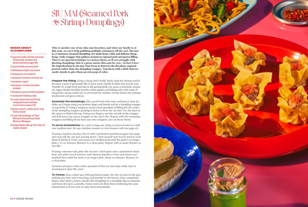 An open *Bad B*tch in the Kitch by Cassie Yeung (Signed!)* from Yu & Me Books displays a SIU MAI recipe beside a plate of dumplings and sauces, capturing Asian takeout classics for home cooking. Other dishes appear partially.