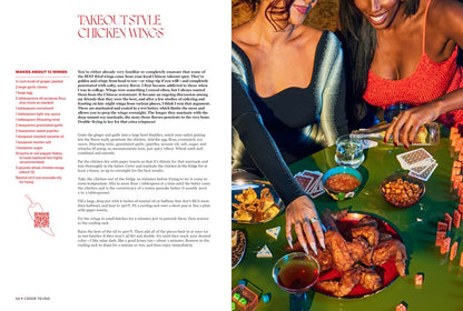 Two women share fried chicken wings, drinks, dice, and cards at a green table. On the left is a chicken wing recipe from Bad B*tch in the Kitch by Cassie Yeung (Signed!), available at Yu & Me Books—perfect for cozy home cooking.