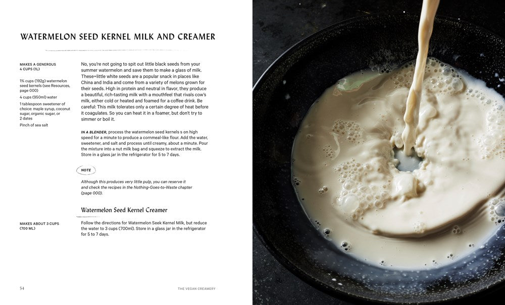 A bowl of creamy vegan milk splashes beside a recipe from Vegan Creamery by Miyoko Schinner (Signed & Personalized) from Yu & Me Books, opened to plant-based dairy recipes like watermelon seed kernel milk and creamer.