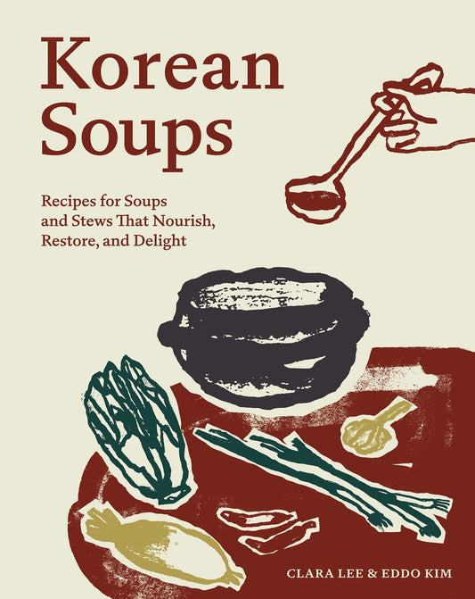 The illustrated cover of *Korean Soups by Clara Lee, Eddo Kim (with Signed Bookplate!)* from Yu & Me Books showcases the vibrant essence of Korean cuisine, depicting fresh vegetables, a bowl, and a hand pouring soup with a ladle. The cover features the title and authors' names: Clara Lee & Eddo Kim.