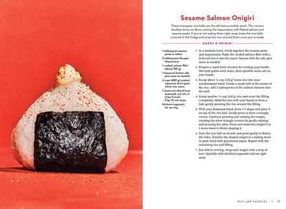A triangular rice ball sits on a white surface. To the right is a Sesame Salmon Onigiri recipe with Japanese mayo from "For the Love of Kewpie" by Elyse Inamine & Jessie YuChen (Signed), sold by Yu & Me Books.