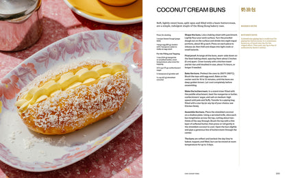 A coconut cream bun sits on a floral plate, topped with piped cream and coconut, beside a silver teapot—a classic Hong Kong treat inspired by Cha Chaan Teng by Lucas Sin (Signed & Personalized!) from Yu & Me Books. A recipe is shown on the right.