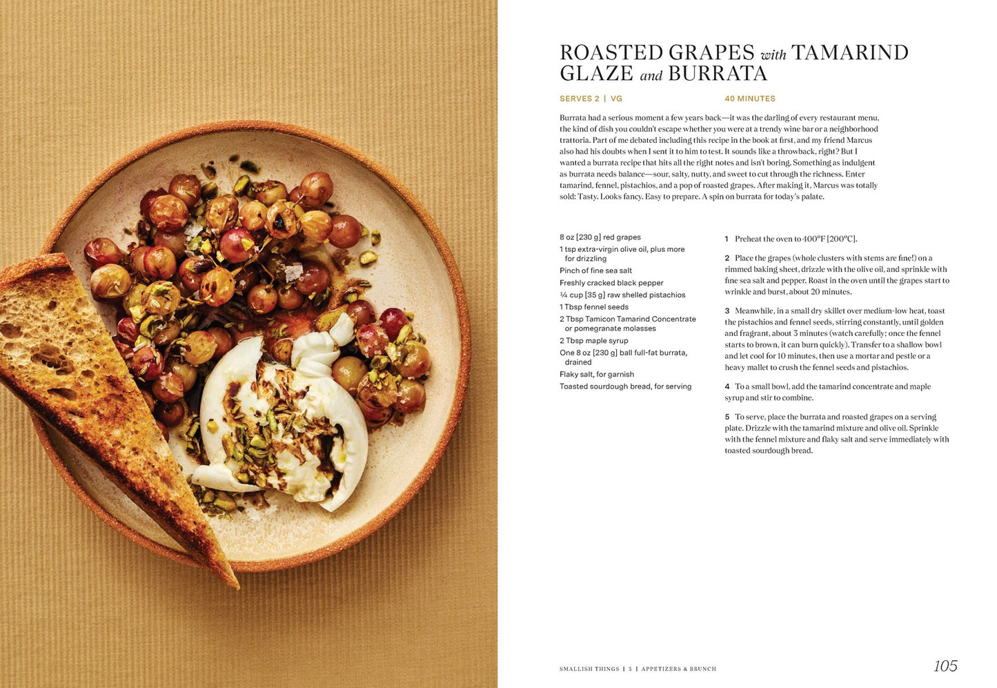 A plate of roasted grapes with seeds, herbs, burrata, and toasted bread sits on a tan surface. Recipe text for Indian-inspired roasted grapes with tamarind glaze from "East to East by Rachel Gurjar" (Yu & Me Books) appears beside it.