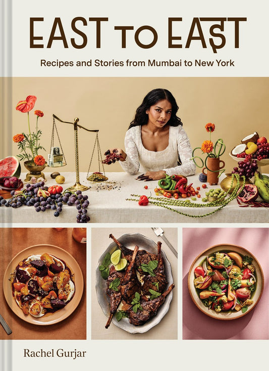 East to East by Rachel Gurjar (Signed & Personalized) from Yu & Me Books features a cover with a woman in white at a table with scales, flowers, and fruit, plus three plates of vibrant Indian-inspired dishes. Subheading: Recipes and Stories from Mumbai to New York.